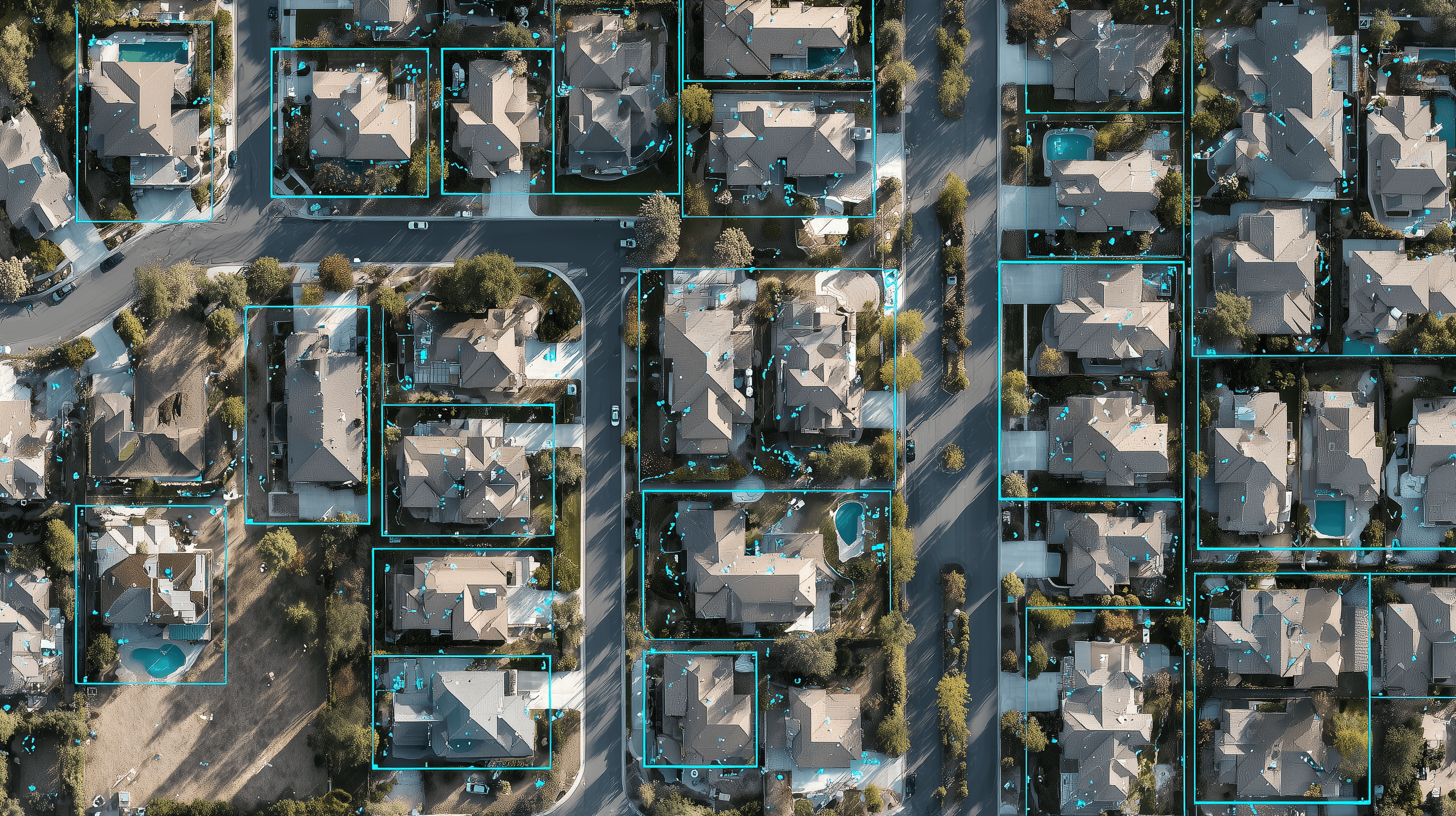 Satellite view of rooftops with AI detection overlays.